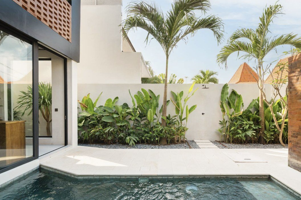 Makia Loft exterior at dusk with private pool and lit interior