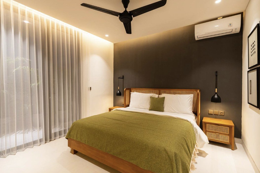 Bedroom 2 with olive green bedspread and ceiling fan
