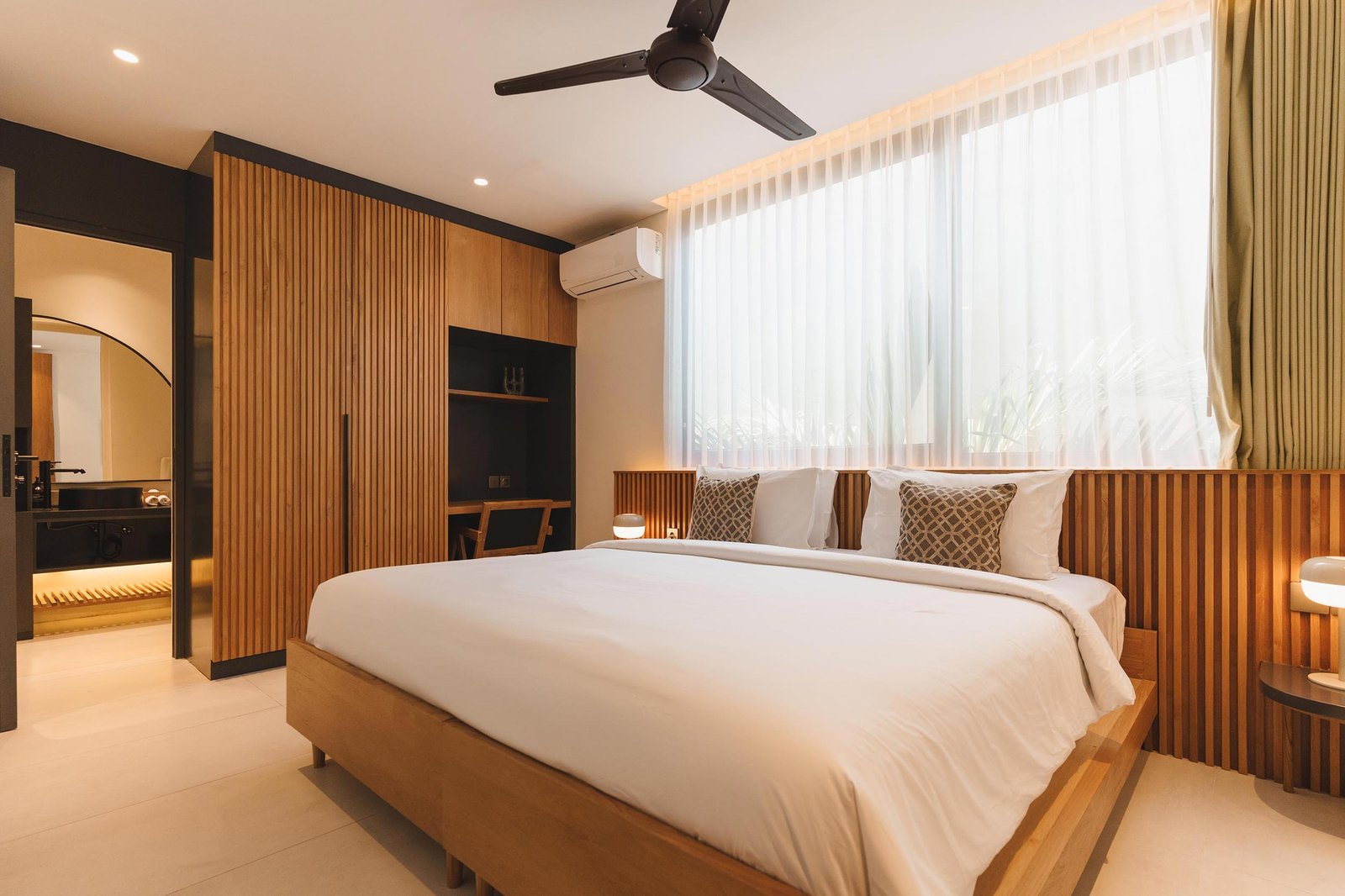 Bedroom 4 with mustard bedspread and rattan headboard